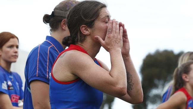 A dejected Ellie Blackburn leaves the ground after coming up short against Collingwood. Picture: Darrian Traynor/Getty Images