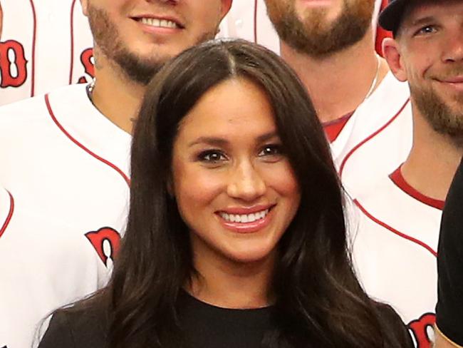 LONDON, ENGLAND - JUNE 29: In this handout image provided by The Invictus Games Foundation, Prince Harry, Duke of Sussex and Meghan, Duchess of Sussex join the Boston Red Sox in their Clubhouse and receive gifts for Archie ahead of their match against the New York Yankees at the London Stadium on June 29, 2019 in London, England. The historic two-game "You Just Cant Beat The Person Who Never Gives Up" series marks the sports first games ever played in Europe and The Invictus Games Foundation has been selected as the official charity of Mitel and MLB London Series 2019. (Photo by Handout/Chris Jackson/Invictus Games Foundation via Getty Images)