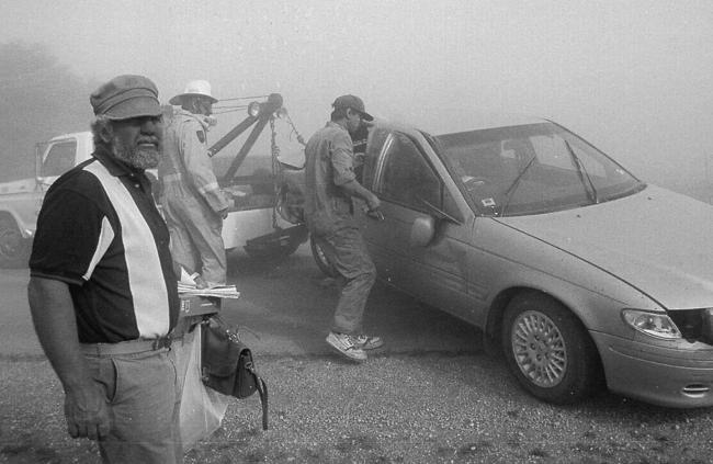 A tow truck towing away car involved in six car pile-up on Balaklava to Port Wakefield Rd in Adelaide during dust storm caused by Vance. Picture: Andrew Manuel