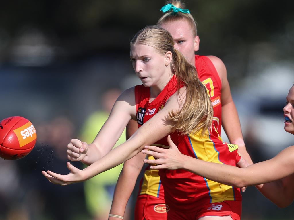 Sunny Lappin of the Gold Coast Suns U18 women's academy handpasses the ball during the 2024 Coates Talent League. Picture: Rob Lawson/AFL Photos.