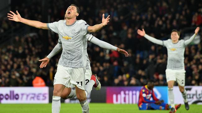 Manchester United's Serbian midfielder Nemanja Matic (C) celebrates