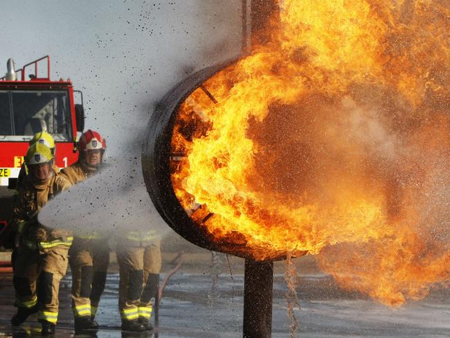 ARFF (Aviation Rescue Fire Fighting) members in a training exercise at Sydney Airport.