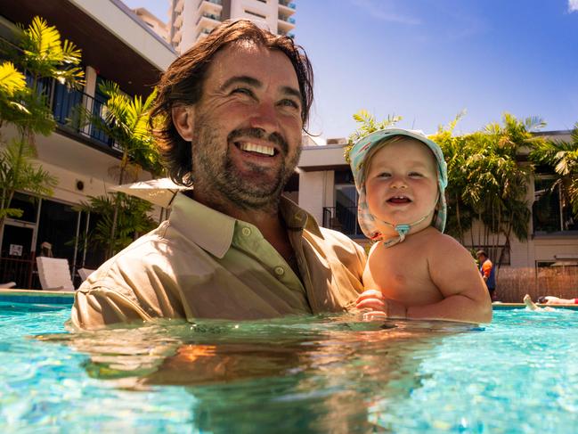 Matt Wright goes for a swim to celebrate his second father's day with baby Banjo at The Cav, Darwin.Picture: Che Chorley