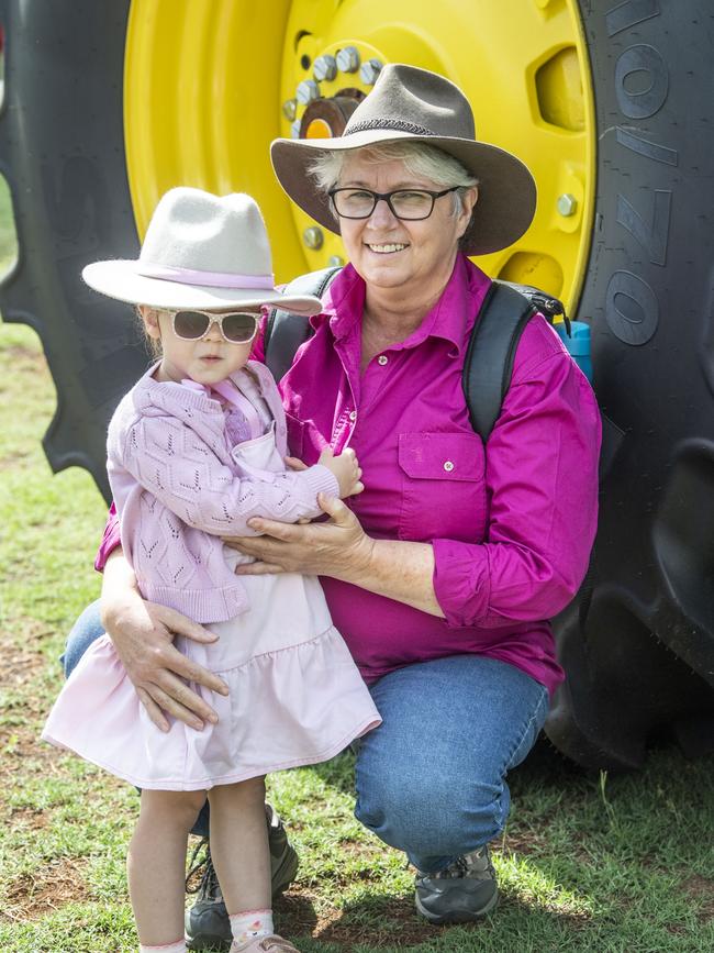 Mandy Davidson with her granddaughter Amelia James check out the tractors. Toowoomba Royal Show. Friday, March 31, 2023. Picture: Nev Madsen.