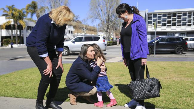 Ms Berejiklian stops to hug to Tiger McDonald, 3, out with grandmother Jill Artemiou in Wagga Wagga. Picture: Dylan Robinson