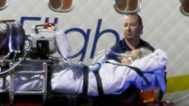 Justine Barwick being transferred to Royal Brisbane Hospital last night. Picture: AAP