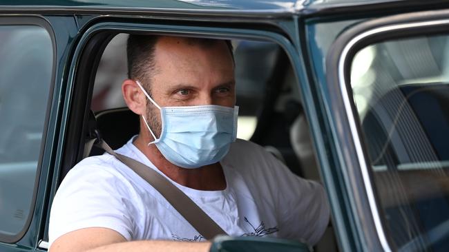 A Brisbane man waits in his car to get a COVID-19 test. Picture: Bradley Kanaris/Getty Images