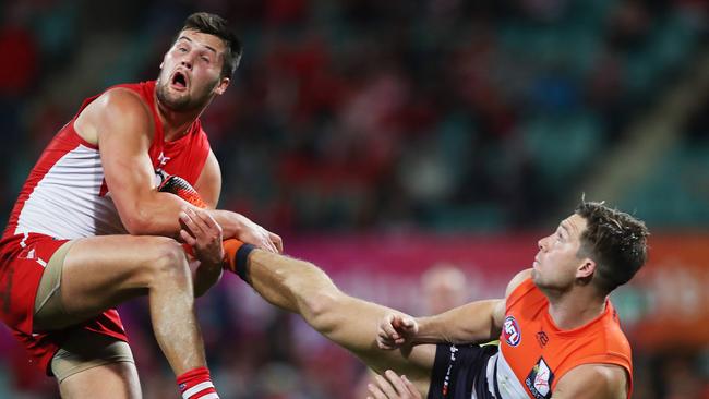 Toby Greene kicks Sydney’s Nic Newman in last year’s elimination final. Picture: Phil Hillyard