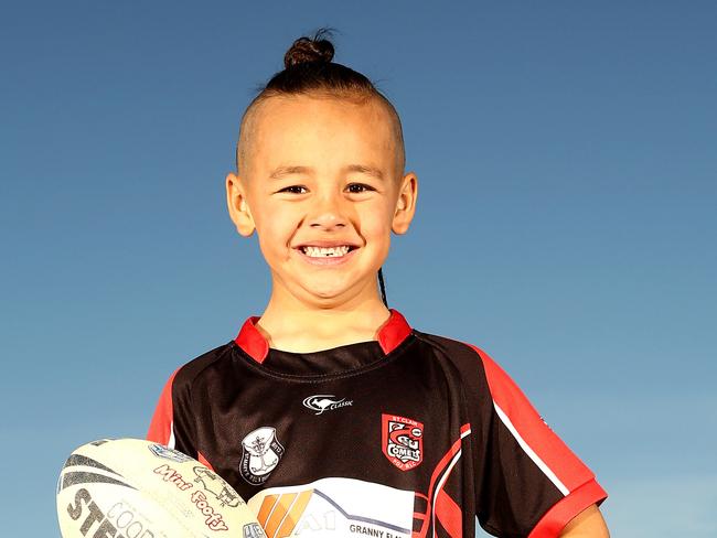 Six year old Isaac Finau poses for photographs at Cook and Banks reserve in St Clair.Isaac Finau has scored over 50 tries for the St Clair Comets under six's.(AAP Image/Justin Sanson)