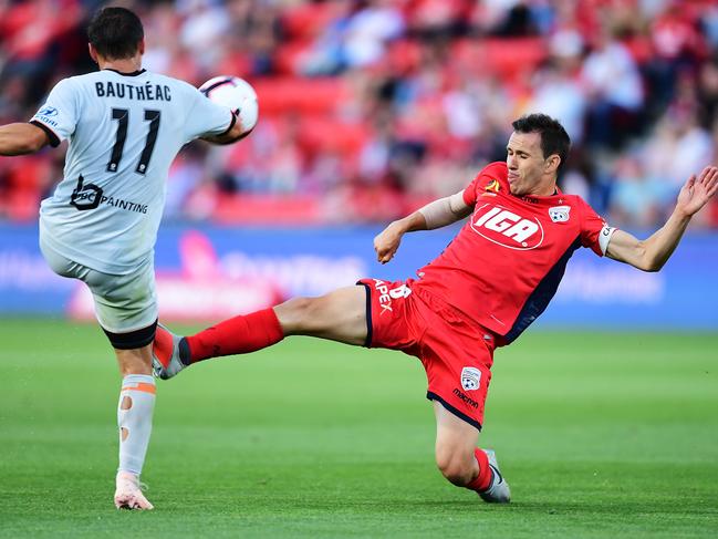 ADELAIDE, AUSTRALIA - NOVEMBER 30:Isaias of Adelaide United  competes with Eric Bautheac of Brisbane Roar   during the round six A-League match between Adelaide United and the Brisbane Roar at Coopers Stadium on November 30, 2018 in Adelaide, Australia.  (Photo by Mark Brake/Getty Images)