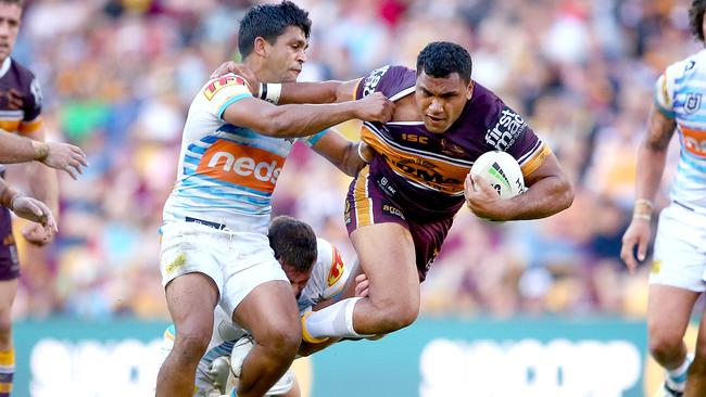 Tyrone Peachey (left) tackles Tevita Pangia Jnr during the Titans’ eight-point win at Suncorp Stadium. Picture: Jono Searle/Getty Images