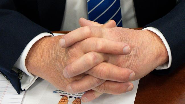 Donald Trump’s hands clasped in the courtroom. Picture: Pool/AFP