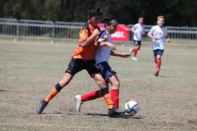 The Premier Invitational football tournament on the Gold Coast. Brisbane Roar Orange v TFC Brisbane White under-13s in action. Picture: Mike Batterham.