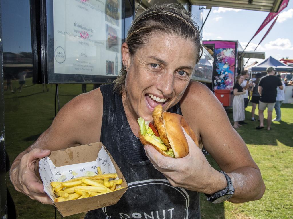 Sandie Loft from the Donut Kitchen with a Motha Clucka ( fried chicken in a donut ) at the Toowoomba Street Food Festival at Pittsworth. Saturday, January 29, 2022. Picture: Nev Madsen.