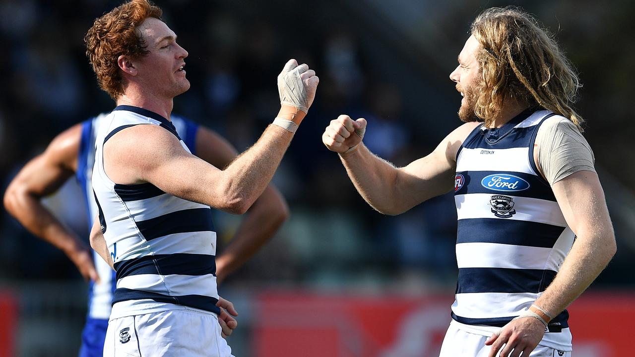 Cameron Guthrie celebrates a goal with Gary Rohan (left). Picture: AFL Photos/via Getty Images