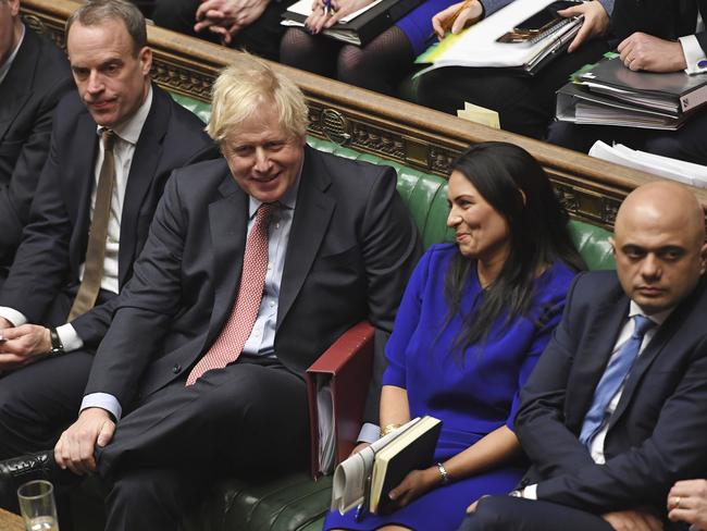 Britain's Prime Minister Boris Johnson during the weekly Prime Minister's Questions inside the House of Commons in London, Wednesday Jan. 29, 2020.  Britain is scheduled to leave Europe from the stroke of midnight on upcoming Friday, with the future relationship between the trading partners to be defined by continuing trade negotiations. Foreign Secretary Dominic Raab, 2nd left, Chancellor of the Exchequer Sajid Javid, right, and Home Secretary Priti Patel, 2nd right. (Jessica Taylor/House of Commons via AP)