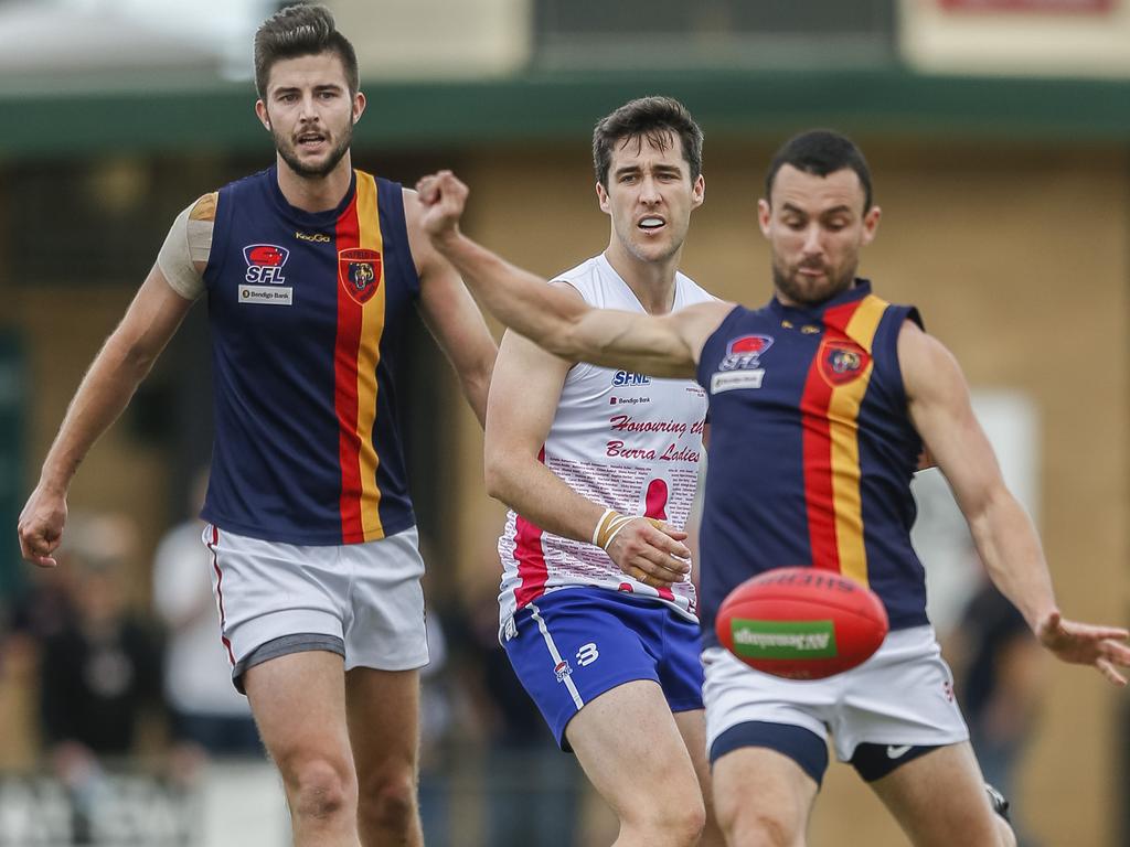 Southern: James Backway of Caulfield gets a kick away against Keysborough. Picture: Valeriu Campan