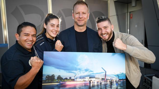 Former Socceroo Vince Grella (3R) and current local players Zak Shojaie (Afghan Victory) Natasha Dakic (southern United) and Mal Suleman (Dandenong South) with the design of the proposed Dandenong Stadium.