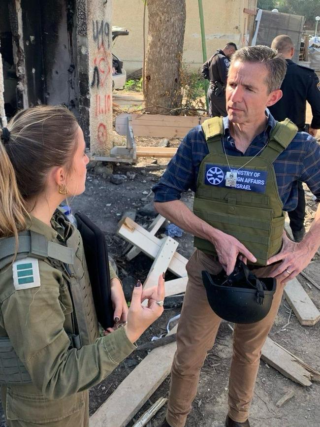 Opposition foreign affairs spokesman Simon Birmingham during a visit to southern Israel, speaking to an IDF soldier at Kfar Aza kibbutz – the site of an October 7 massacre by Hamas terrorists.