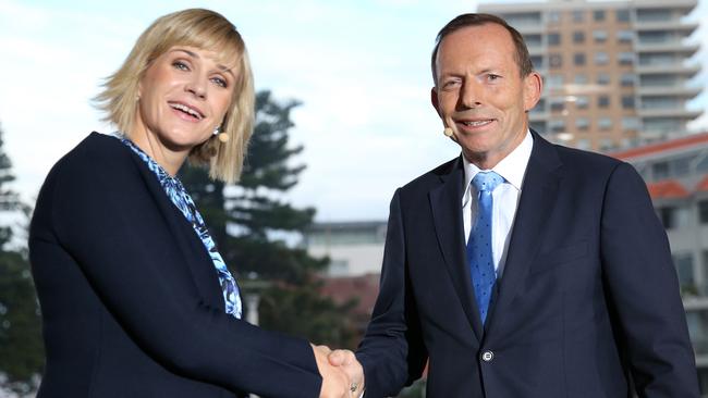 Warringah candidates Tony Abbott and Zali Steggall shake hands at the beginning of the Sky News/Manly Daily Debate at Queenscliff Surf Club. Picture: by Damian Shaw/News Corp Australia via Getty Images)