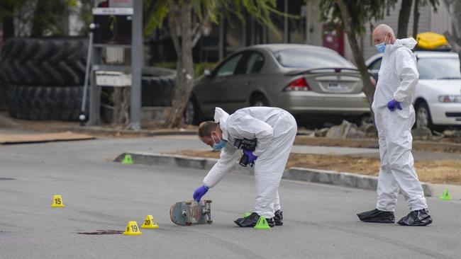 Police examine the crime scene at Welland. Picture: RoyVphotography