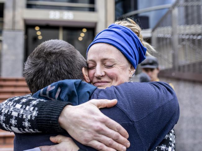 Lisa Searle is hugged by a supporter after being sentenced over her protest action at the Riley Creek mine site. Picture: Eddie Safarik