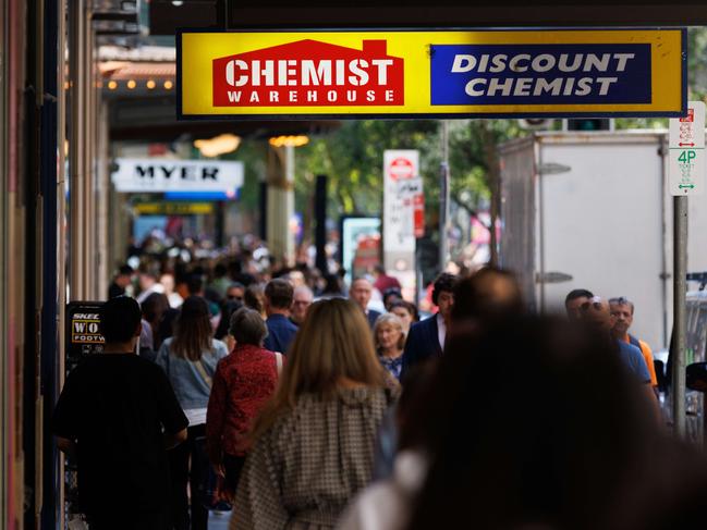 SYDNEY, AUSTRALIA - NewsWire Photos, October 29 2024. GENERIC. Inflation. Shopping. Retail. Economy. Cost of living crisis. Crowded footpath beneath a Chemist Warehouse sign. Picture: NewsWire / Max Mason-Hubers