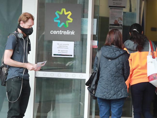 24/3/20: People queue at Centrelink at Marrickville. John Feder/The Australian.