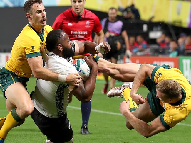 SAPPORO, JAPAN - SEPTEMBER 21: Peceli Yato of Fiji is tackled by Nicholas White of Australia during the Rugby World Cup 2019 Group D game between Australia and Fiji at Sapporo Dome on September 21, 2019 in Sapporo, Hokkaido, Japan. (Photo by Shaun Botterill/Getty Images)