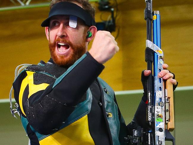 Australia's Dane Sampson reacts after winning the 10m air rifle men's final competition during the 2018 gold Coast Commonwealth Games at the Belmont Shooting Complex in Brisbane on April 8, 2018. / AFP PHOTO / Patrick HAMILTON