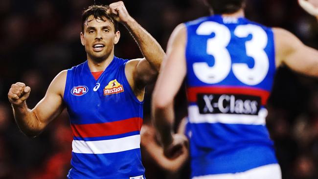 Sam Lloyd celebrates one of the Bulldogs 21 unanswered goals. Picture: AAP