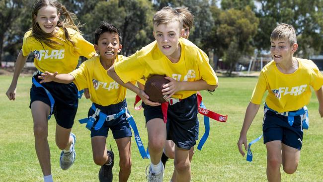 Kidman Park NFL Teams Archie Ferris goes for a touch down chased by Paige Schroeder,Ky Morata,Charlie Castro-Winner and Hayden Ashfield , at Kidman Park Primary school before the head off to represent SA in the nationals .Wednesday,October,30,2024.Picture Mark Brake