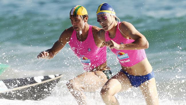 Hugh Dougherty and Daniel Collins competing in a swim relay.