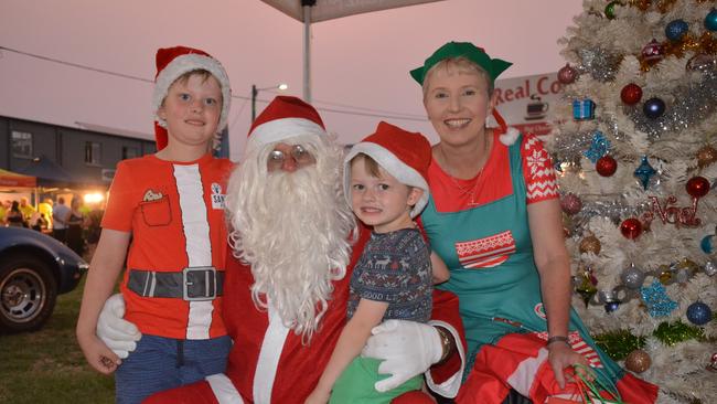 William and Eddie Morrow meet Santa Claus and his elf councillor Roz Frohloff at the Nanango Family Christmas Carnival on December 20, 2019. (Photo: Jessica McGrath)