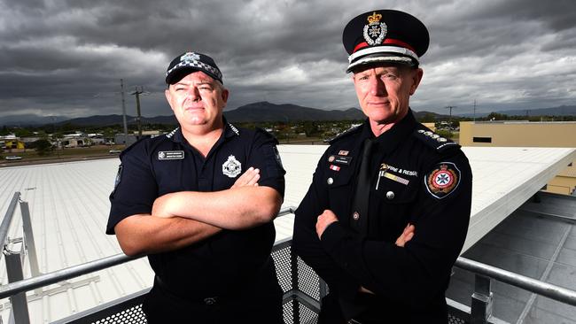 Senior Sergeant Brenton Webb and Inspector Mark McKenzie from QFES stand atop the Centre. The Centre’s roof is equipped with weather reading technology. Picture: Zak Simmonds