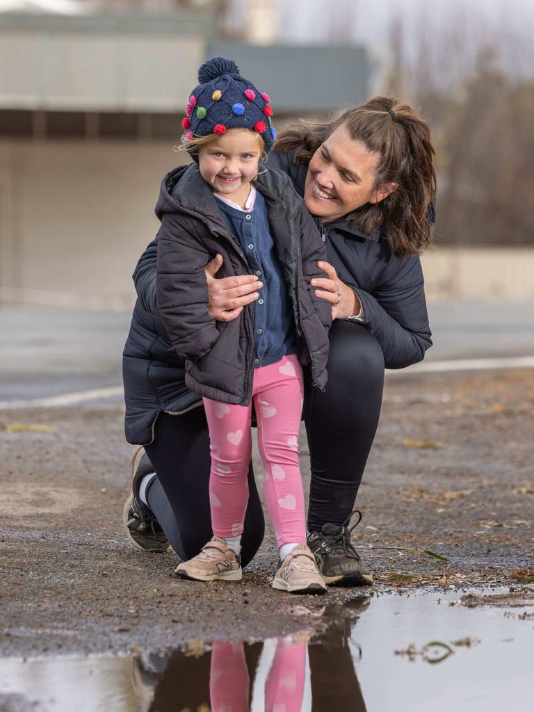 Alex Branden and her daughter Charlotte of Jamestown excited to see puddles of water finally. Picture: Ben Clark