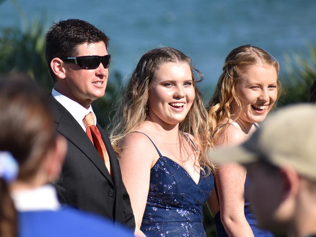 Maclean High School Year 12 students share a moment with teacher and year advisor Benjamin Patch.