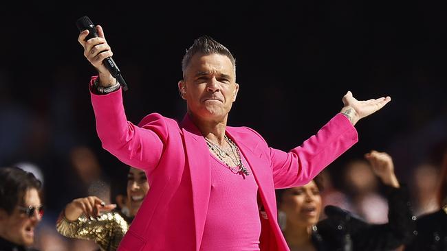 MELBOURNE, AUSTRALIA - SEPTEMBER 24: Robbie Williams performs during the 2022 AFL Grand Final match between the Geelong Cats and the Sydney Swans at the Melbourne Cricket Ground on September 24, 2022 in Melbourne, Australia. (Photo by Daniel Pockett/AFL Photos/via Getty Images)