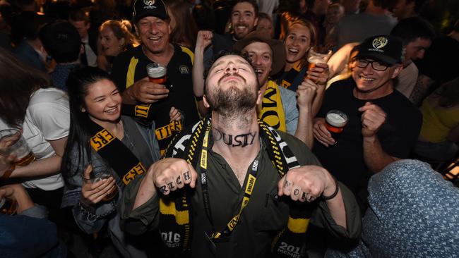 Tigers Supporter Fraser Cameron shows off his fake Dusty neck tattoo at the Corner Hotel after the Richmond victory. Picture: Tony Gough