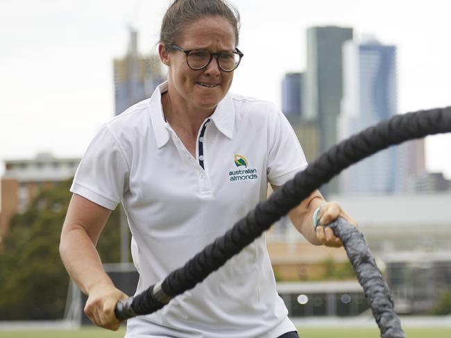 North Melbourne's AFLW captain Emma Kearney hard at work using the battle ropes.