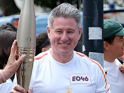 PARIS FRANCE 2024 OLYMPIC GAMES. Nine CEO Mike Sneesby carries the Paris Olympics torch in the Olympic torch relay. Pic: JACQUELIN MAGNAY