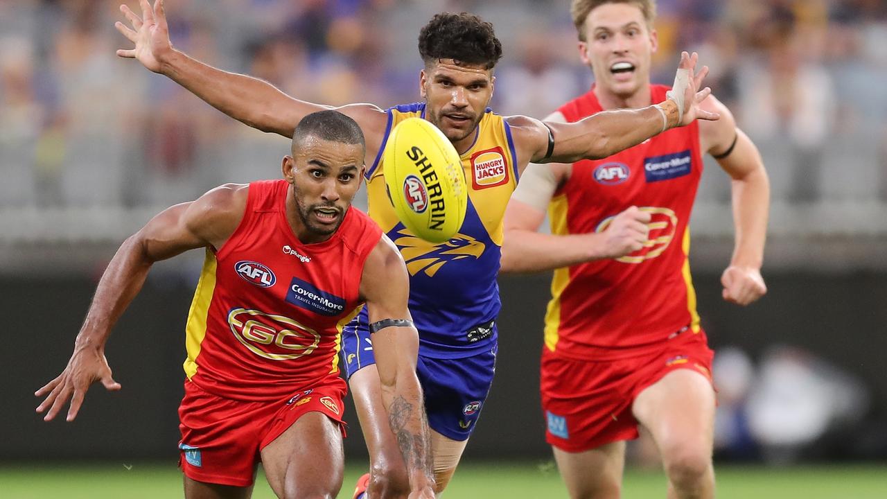 Miller chases the ball against West Coast during Round 1 of the 2022 season.