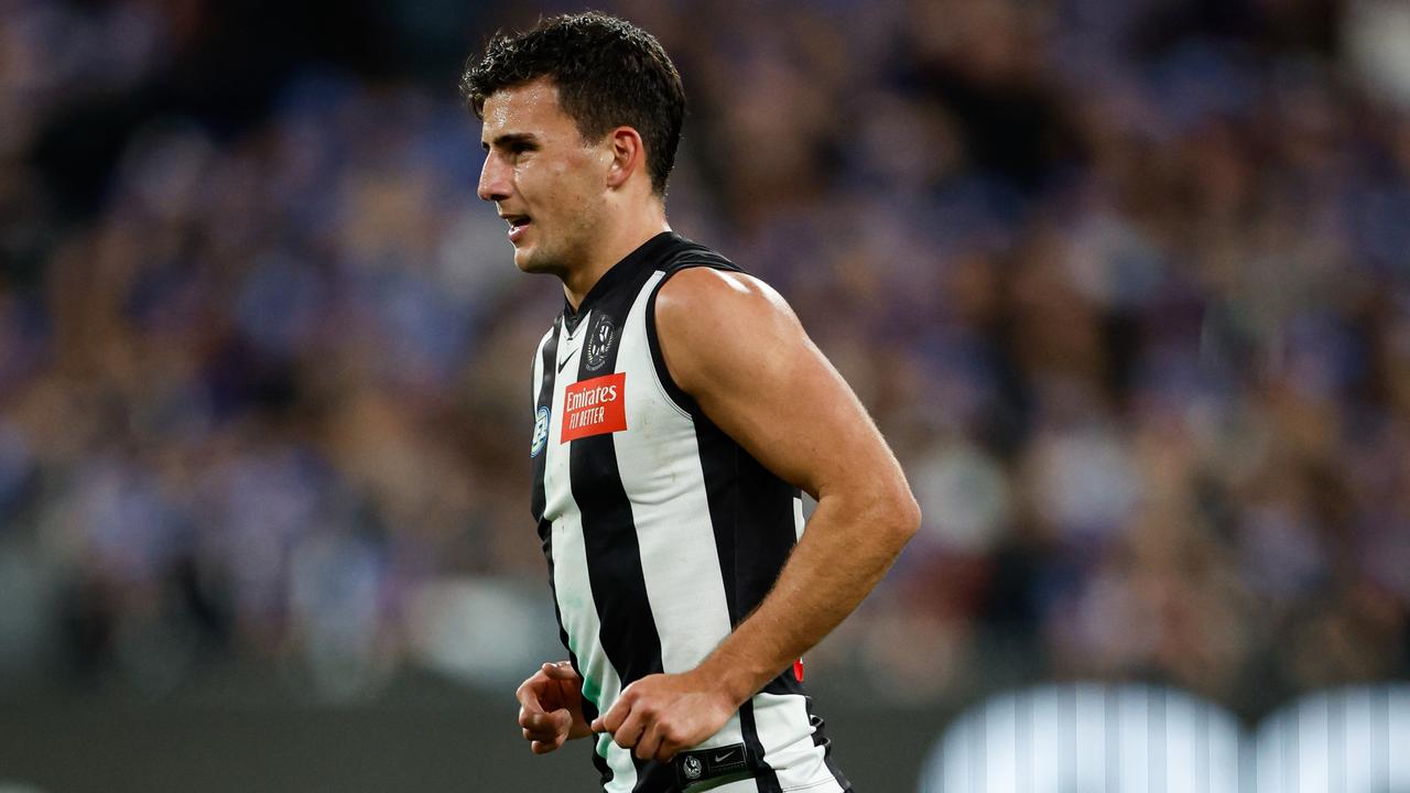 MELBOURNE, AUSTRALIA - JUNE 10: Nick Daicos of the Magpies leaves the field with a limp during the 2024 AFL Round 13 match between the Collingwood Magpies and the Melbourne Demons at The Melbourne Cricket Ground on June 10, 2024 in Melbourne, Australia. (Photo by Dylan Burns/AFL Photos via Getty Images)
