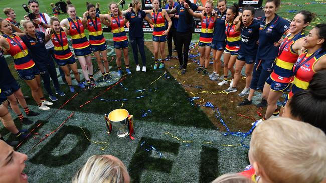 Crows players celebrate after winning the AFLW grand final against Carlton at Adelaide Oval on Sunday. Picture: AAP/David Mariuz