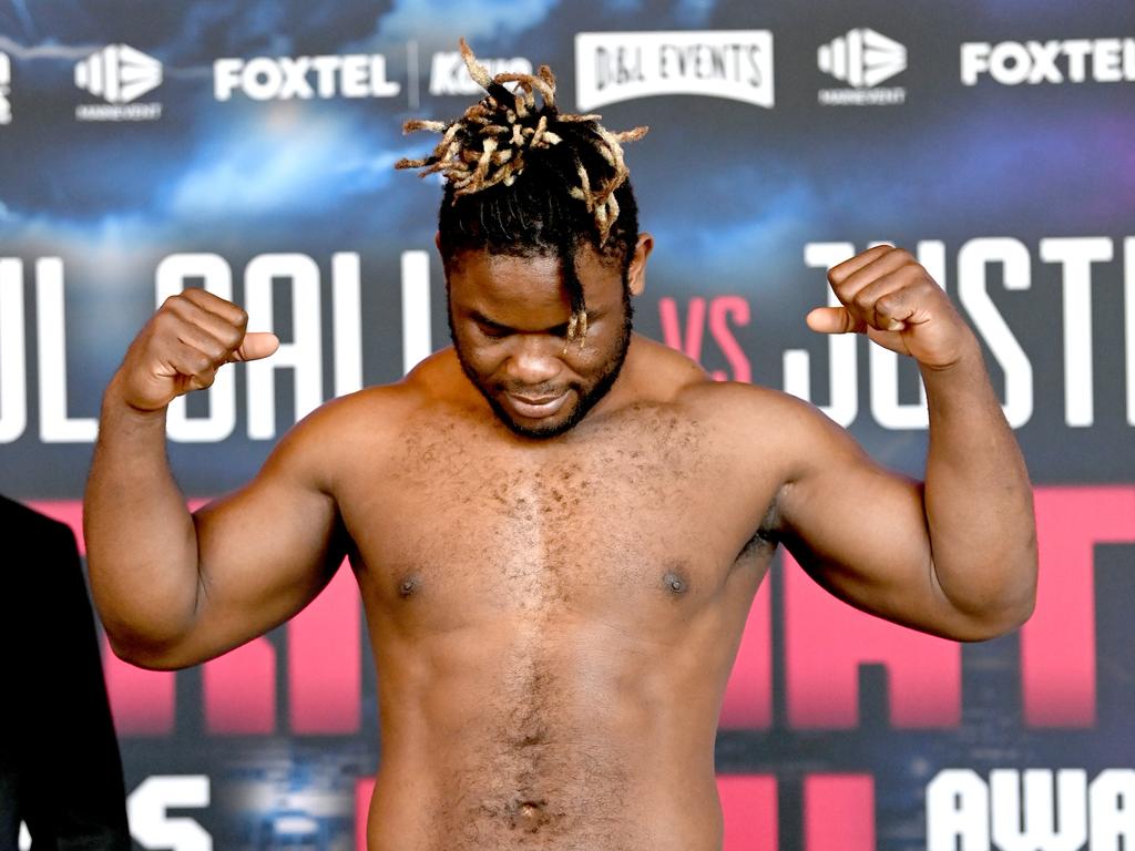 Christian Tsoye was made to weigh in in front the Paul Gallen vs Justis Huni banner.