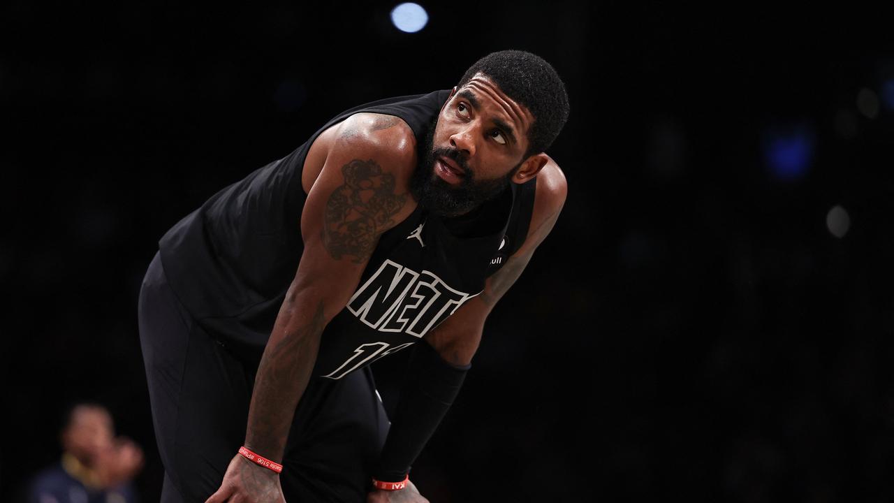 (FILES) In this file photo taken on October 31, 2022 Kyrie Irving #11 of the Brooklyn Nets looks on during a break in the action during the fourth quarter of the game against the Indiana Pacers at Barclays Center in New York City. - The Brooklyn Nets suspended Kyrie Irving for at least five games on Thursday, saying they were "dismayed" by the NBA star's response after he was criticised for posting a link to anti-semitic material. (Photo by Dustin Satloff / GETTY IMAGES NORTH AMERICA / AFP)