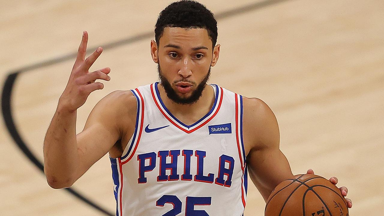 Philadelphia 76ers' Ben Simmons (25) reacts after dunking the ball