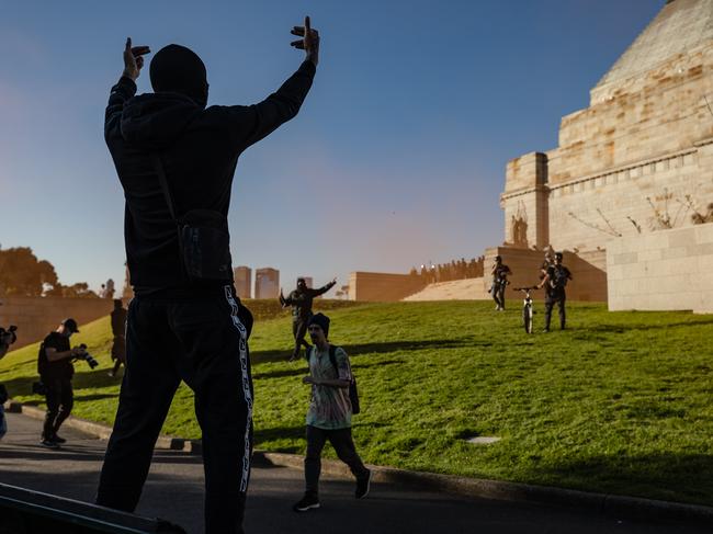 A man gestures towards police at the Shrine of Remembrance. Picture: Jason Edwards