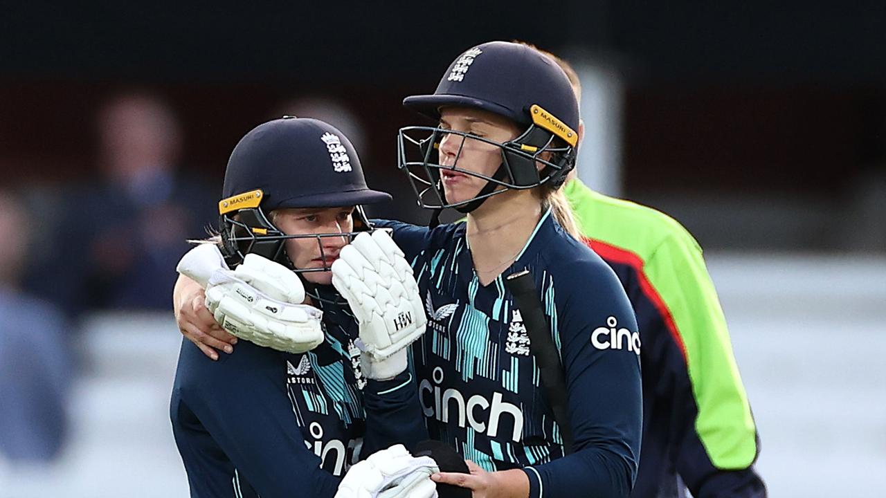 LONDON, ENGLAND - SEPTEMBER 24: Charlie Dean of England is consoled by Freya Davies of England after Dean was run out (Madkad) by Deepti Sharma of India to claim victory during the 3rd Royal London ODI between England Women and India Women at Lord's Cricket Ground on September 24, 2022 in London, England. (Photo by Ryan Pierse/Getty Images)