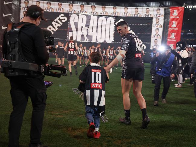 Jax ran through the banner with his dad. Picture: Daniel Pockett/Getty Images